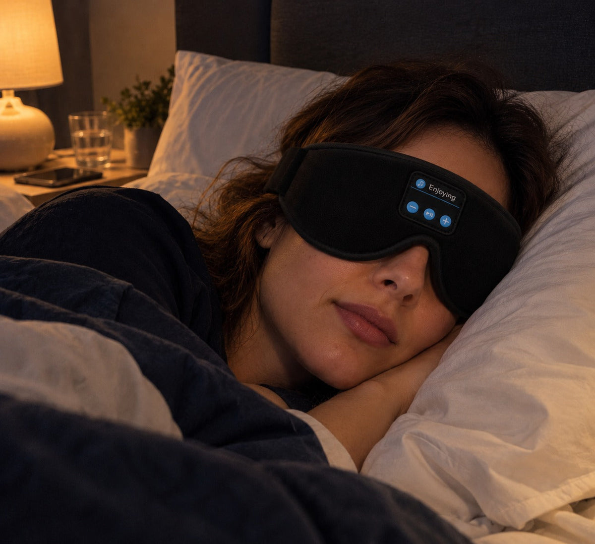 Woman sleeping with the Lullwave Bluetooth sleep mask